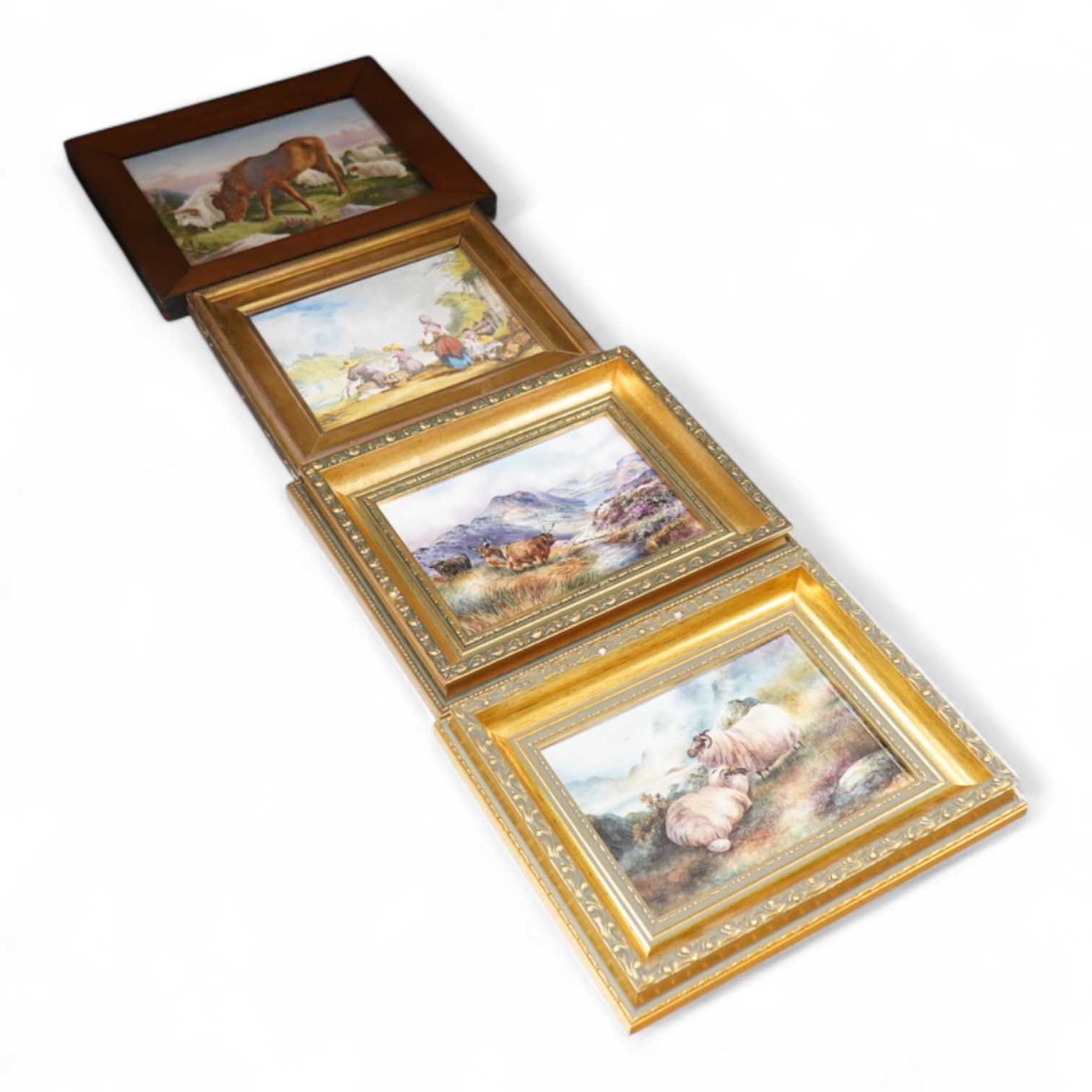 Four porcelain framed plaques, 19th and 20th century hand painted with highland landscapes and figures, two by James Skerrett, gilt framed, largest 21 x 26cm overall